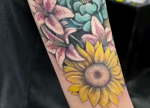 Video of full color 3d botanical tattoo