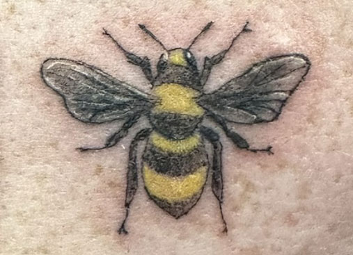 Video of a full sleeve botanical tattoo